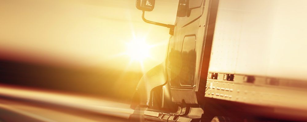 Truck driving off into the sunset