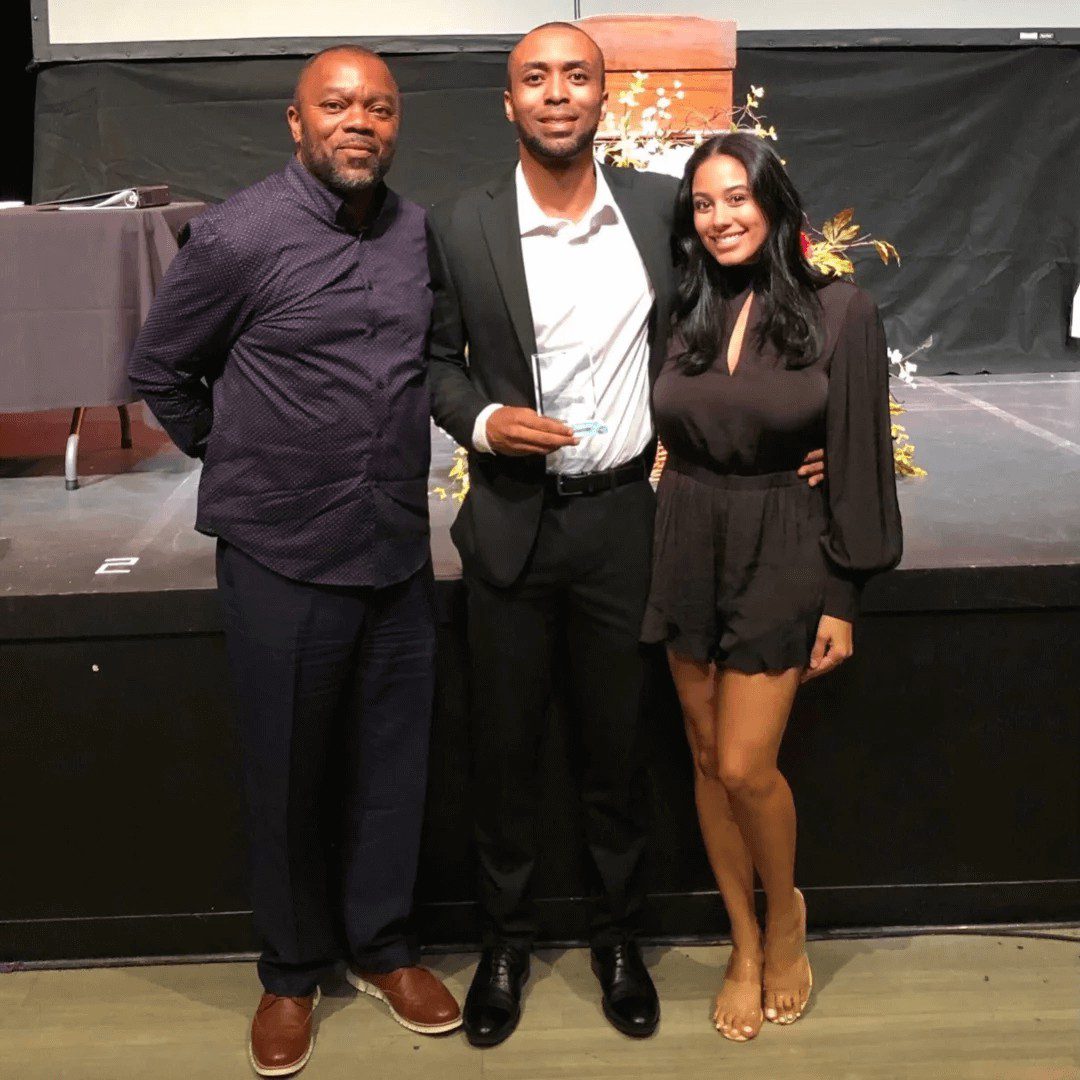 Chris Allen with his girlfriends and friend accepting award