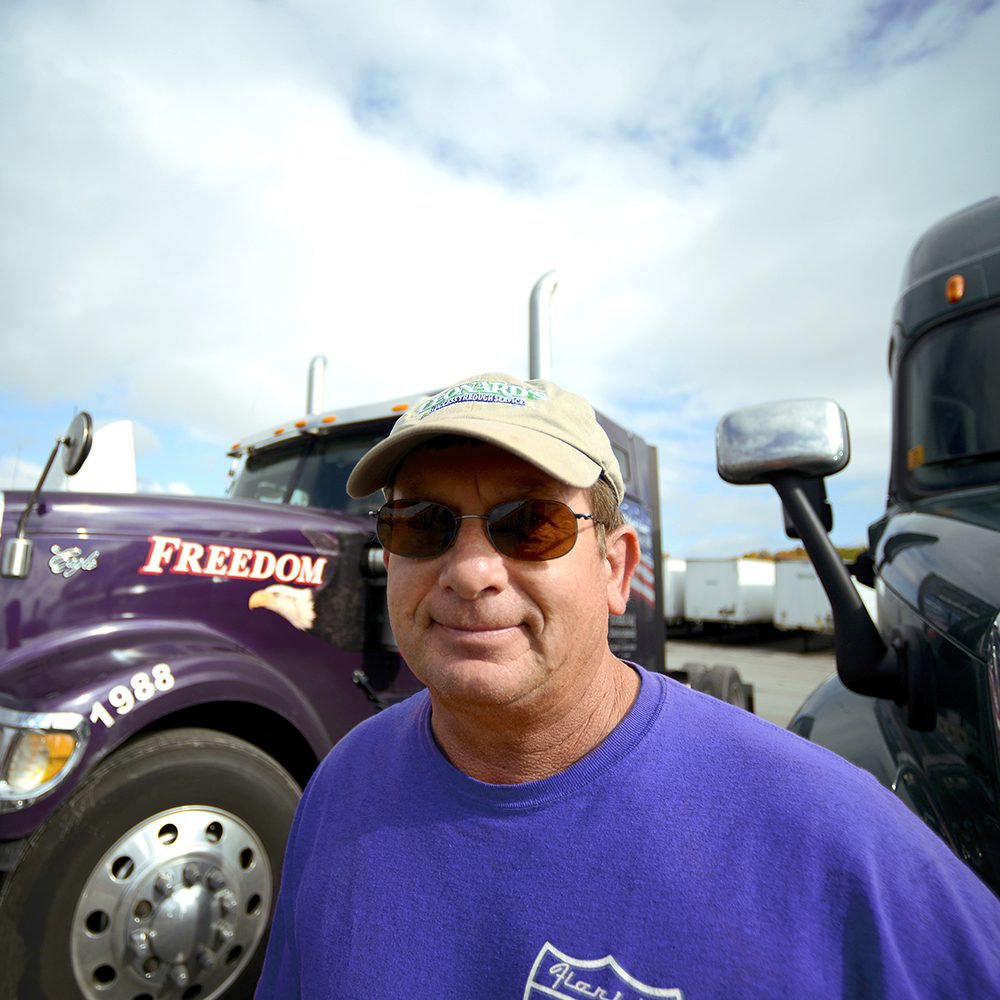 freedom trucking and man with sunglasses