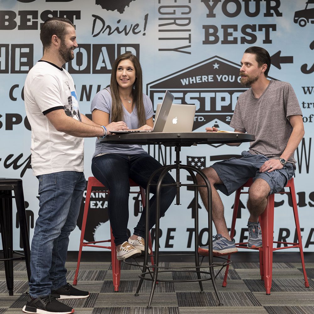 employees standing around table